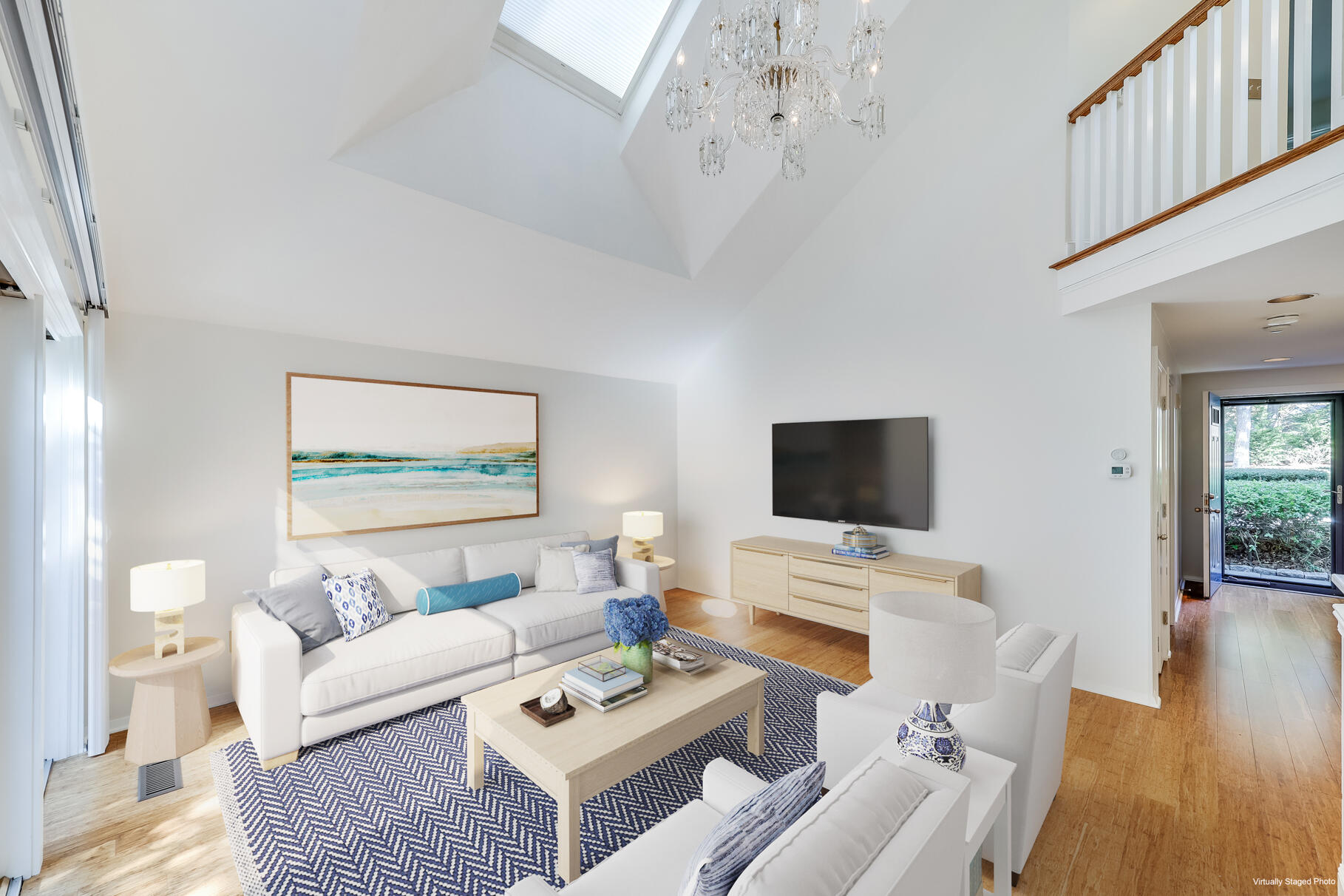 68 Mid-Iron Way, Unit 7545 Mashpee, MA 02649 - Photo 7 of 43 a living room with furniture and a flat screen tv