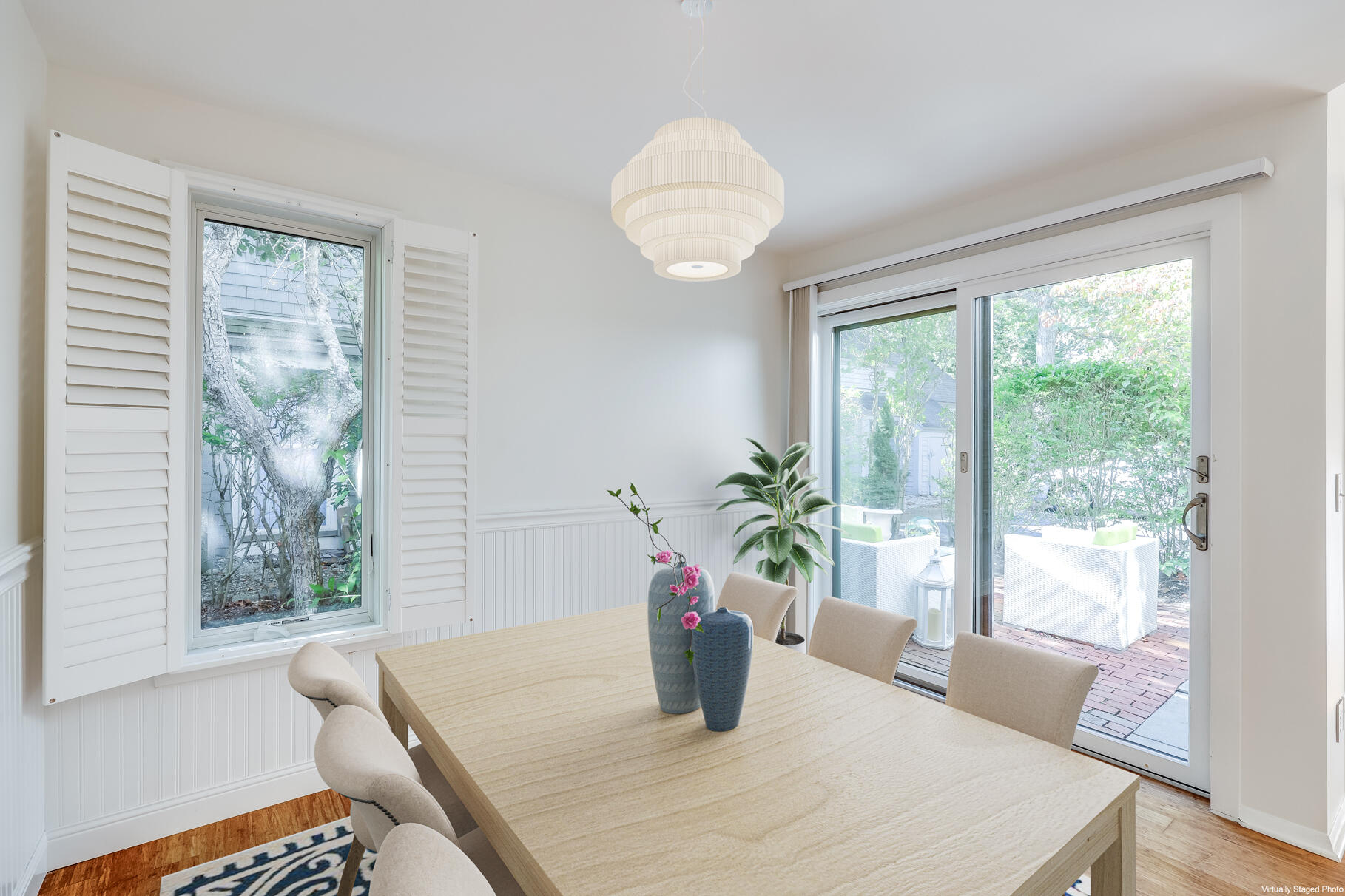 68 Mid-Iron Way, Unit 7545 Mashpee, MA 02649 - Photo 9 of 43 a view of a dining room with furniture window and wooden floor
