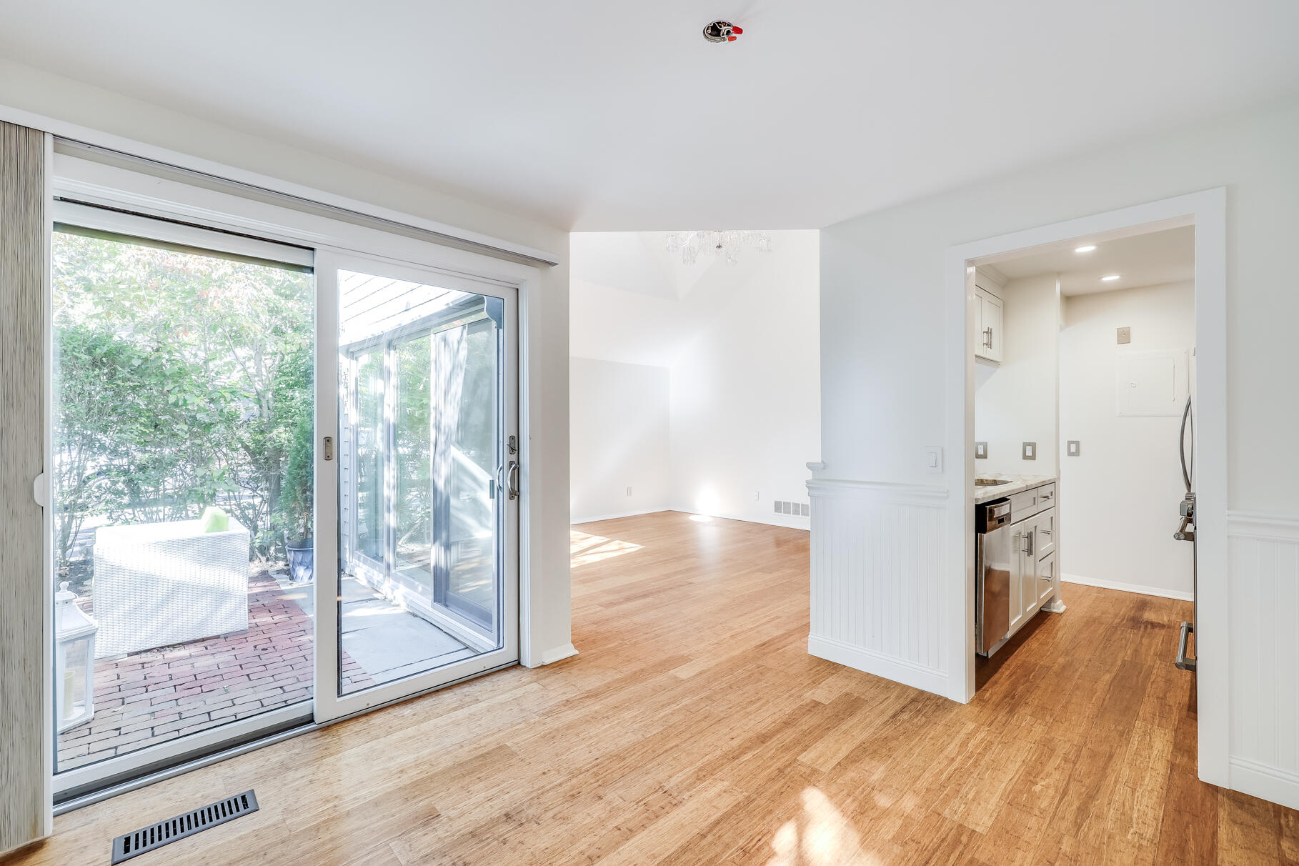 68 Mid-Iron Way, Unit 7545 Mashpee, MA 02649 - Photo 10 of 43 a view of a kitchen with wooden floor and a kitchen