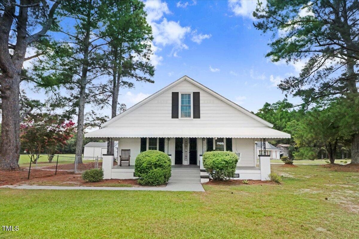 175 Debro Road Kenly, NC 27542 - Photo 1 of 30 a front view of a house with a yard
