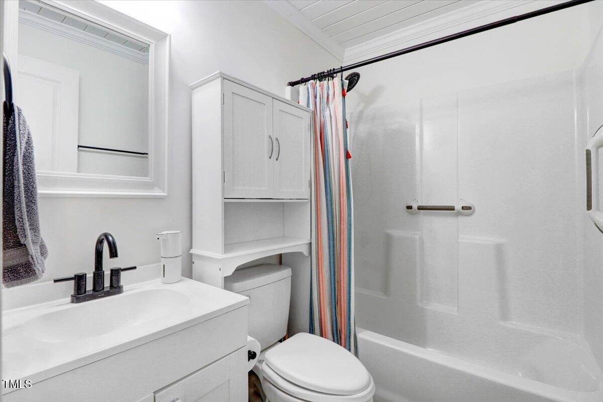 175 Debro Road Kenly, NC 27542 - Photo 18 of 30 a bathroom with a sink toilet and shower