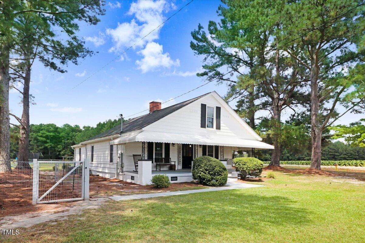 175 Debro Road Kenly, NC 27542 - Photo 2 of 30 a front view of a house with a yard balcony