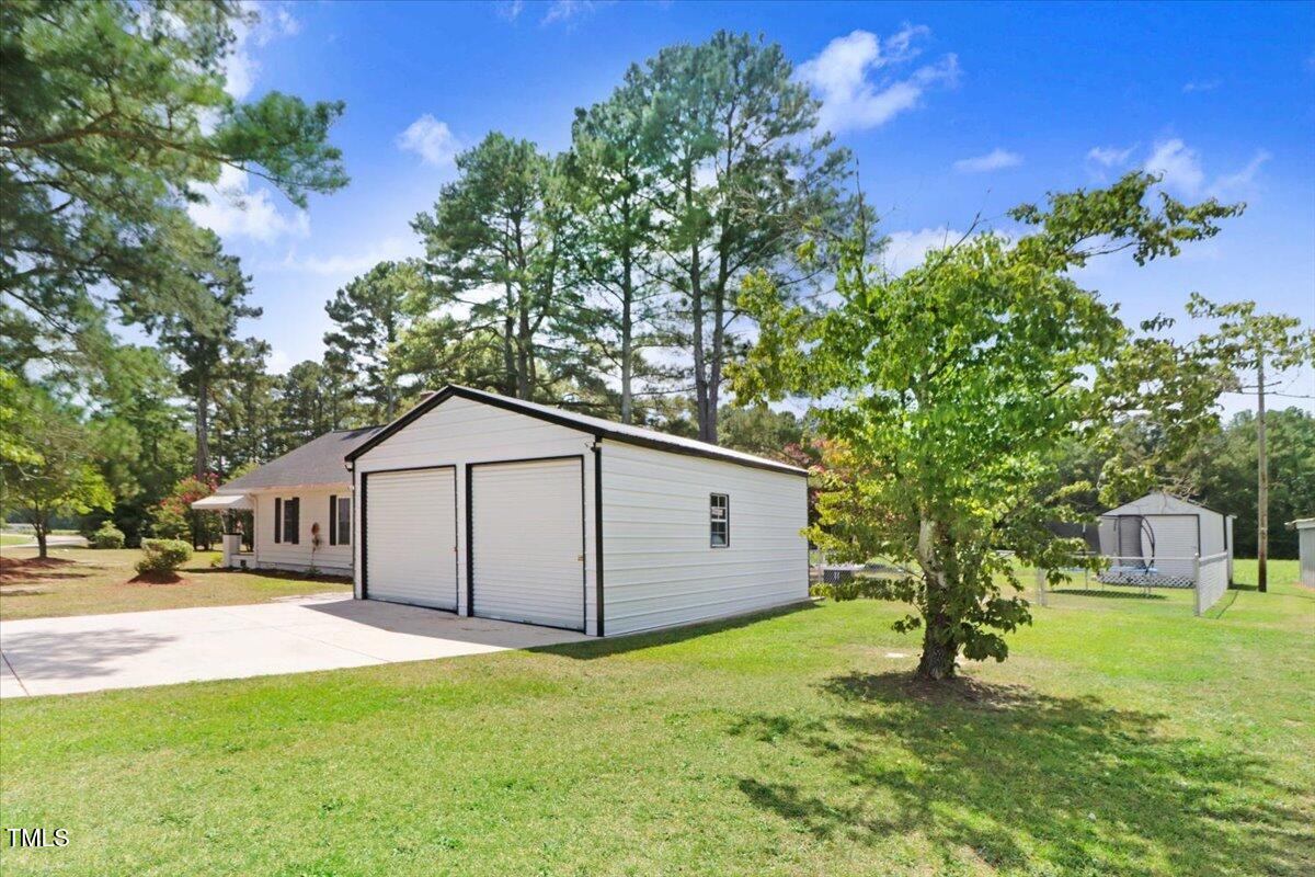 175 Debro Road Kenly, NC 27542 - Photo 24 of 30 a house view with a garden space