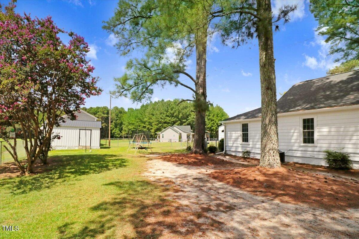 175 Debro Road Kenly, NC 27542 - Photo 28 of 30 a view of a house with a yard