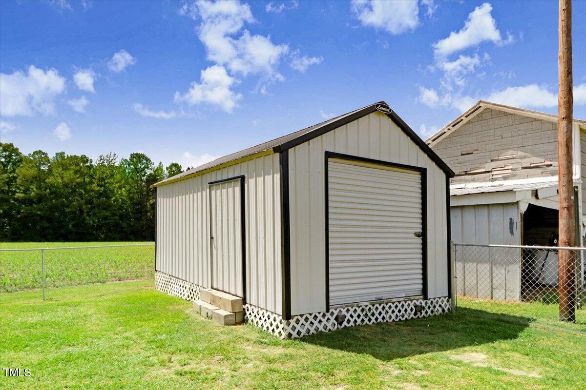 175 Debro Road Kenly, NC 27542 - Photo 30 of 30 a backyard of a house with lots of green space