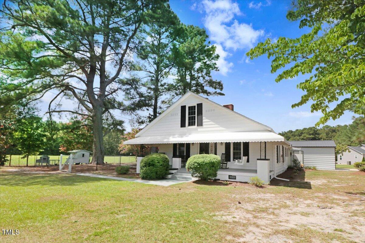 175 Debro Road Kenly, NC 27542 - Photo 3 of 30 a front view of a house with swimming pool