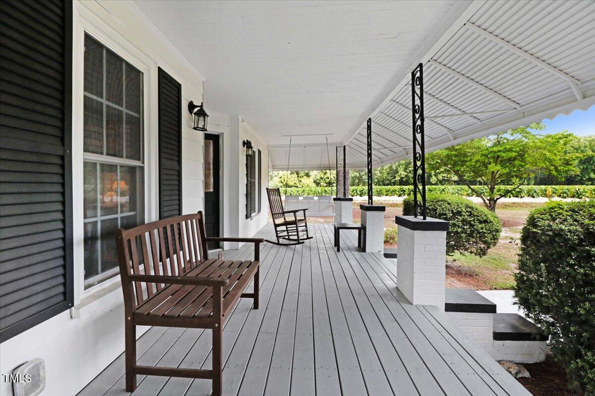 175 Debro Road Kenly, NC 27542 - Photo 4 of 30 a view of a chairs and table in patio with potted plants