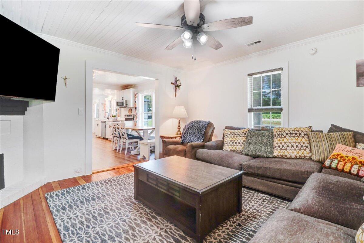 175 Debro Road Kenly, NC 27542 - Photo 7 of 30 a living room with furniture and a flat screen tv