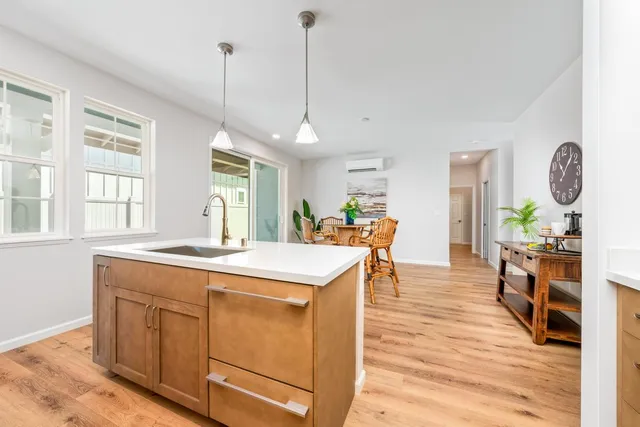 a room with wooden floor and window