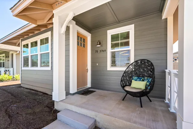 a view of a two chairs in a patio
