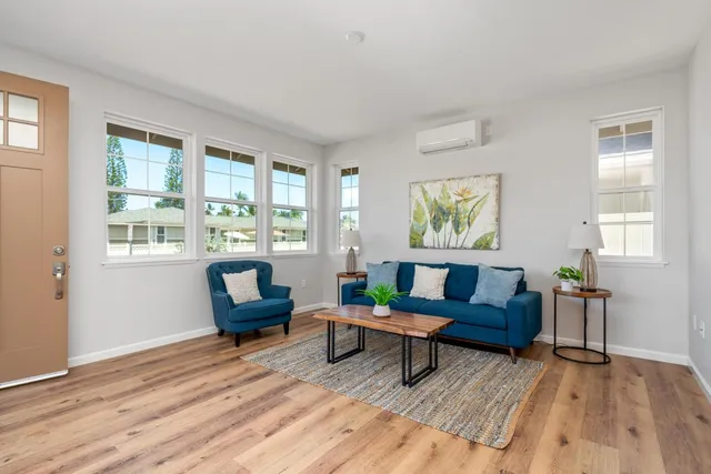 a living room with furniture and a window