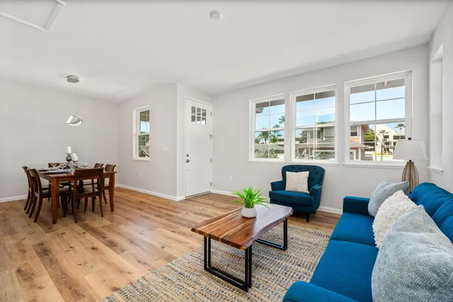 a living room with furniture and a table