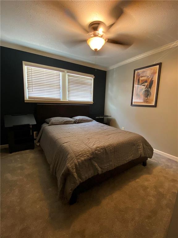 4701 Flat Shoals Road, Unit 54G Union City, GA 30291 - Photo 11 of 18 a bedroom with a bed and a window