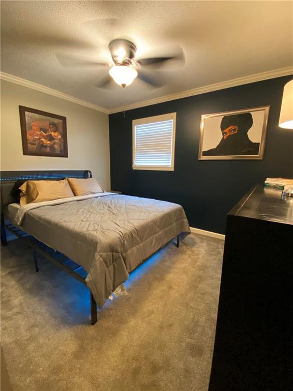 4701 Flat Shoals Road, Unit 54G Union City, GA 30291 - Photo 12 of 18 a bedroom with a bed and a desk