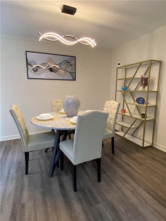 4701 Flat Shoals Road, Unit 54G Union City, GA 30291 - Photo 7 of 18 a view of a dining room with furniture and wooden floor