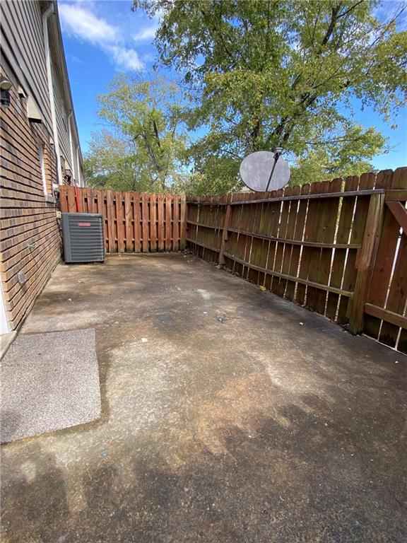 4701 Flat Shoals Road, Unit 54G Union City, GA 30291 - Photo 10 of 18 a view of a backyard with a small cabin and wooden fence