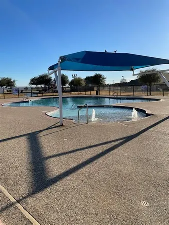 a view of swimming pool with outdoor seating