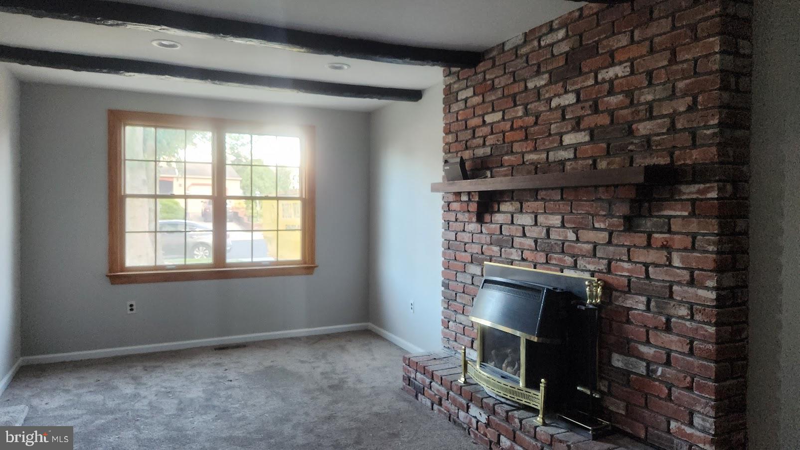 6 Cedar Creek Drive Clementon, NJ 08021 - Photo 6 of 14 a living room with a fireplace and a window
