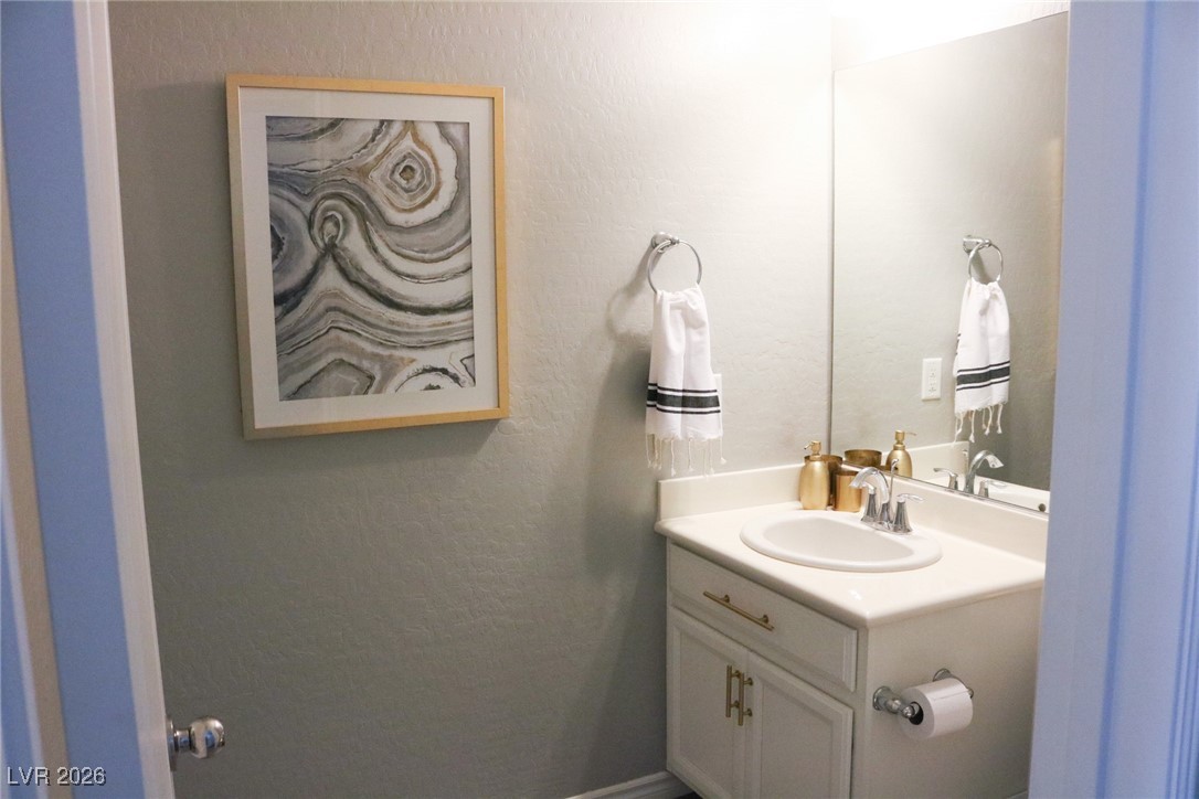 12457 Loggeta Way Las Vegas, NV 89141 - Photo 13 of 25 Downstairs 1/2 bath