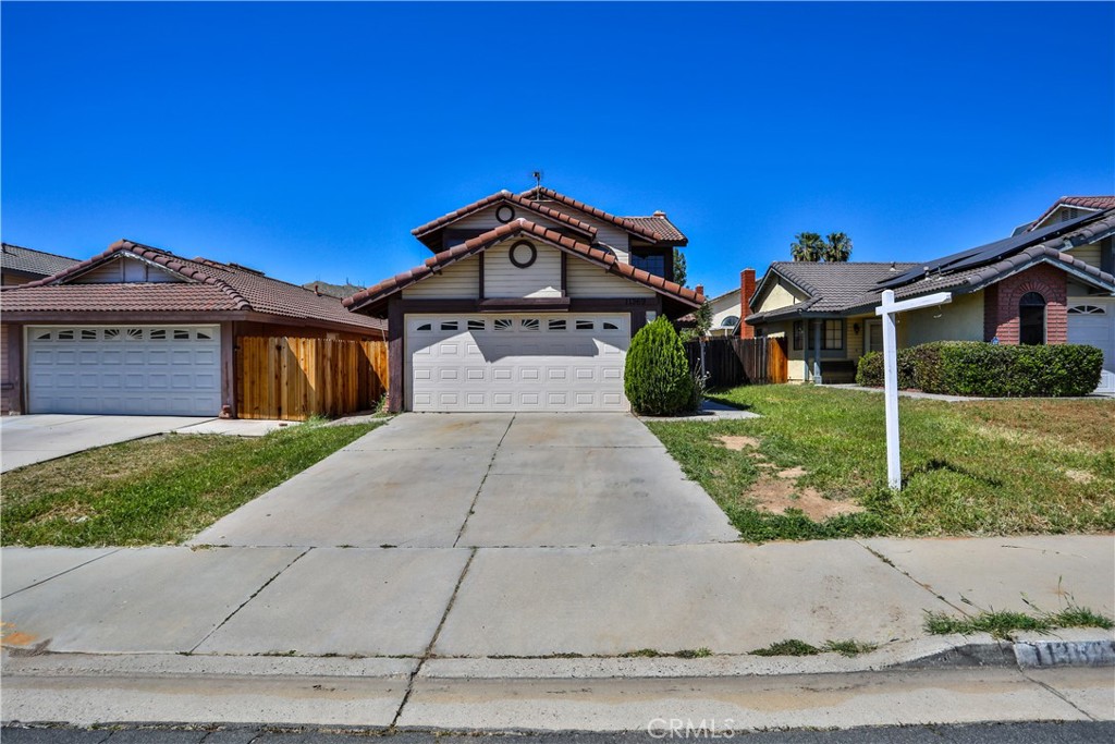 11369 Red Hill Road Moreno Valley, CA 92557 - Photo 2 of 41 front view of a house with a yard