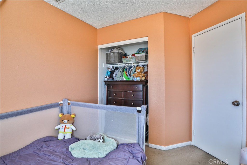 11369 Red Hill Road Moreno Valley, CA 92557 - Photo 27 of 41 a living room with furniture and a table