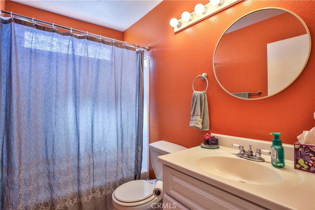 11369 Red Hill Road Moreno Valley, CA 92557 - Photo 28 of 41 a bathroom with a sink and toilet