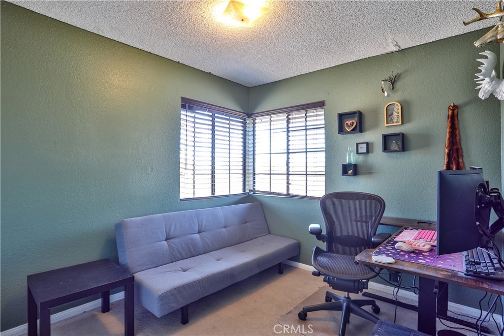 11369 Red Hill Road Moreno Valley, CA 92557 - Photo 29 of 41 a living room with furniture and a window