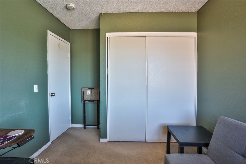 11369 Red Hill Road Moreno Valley, CA 92557 - Photo 30 of 41 a view of room with furniture and a potted plant