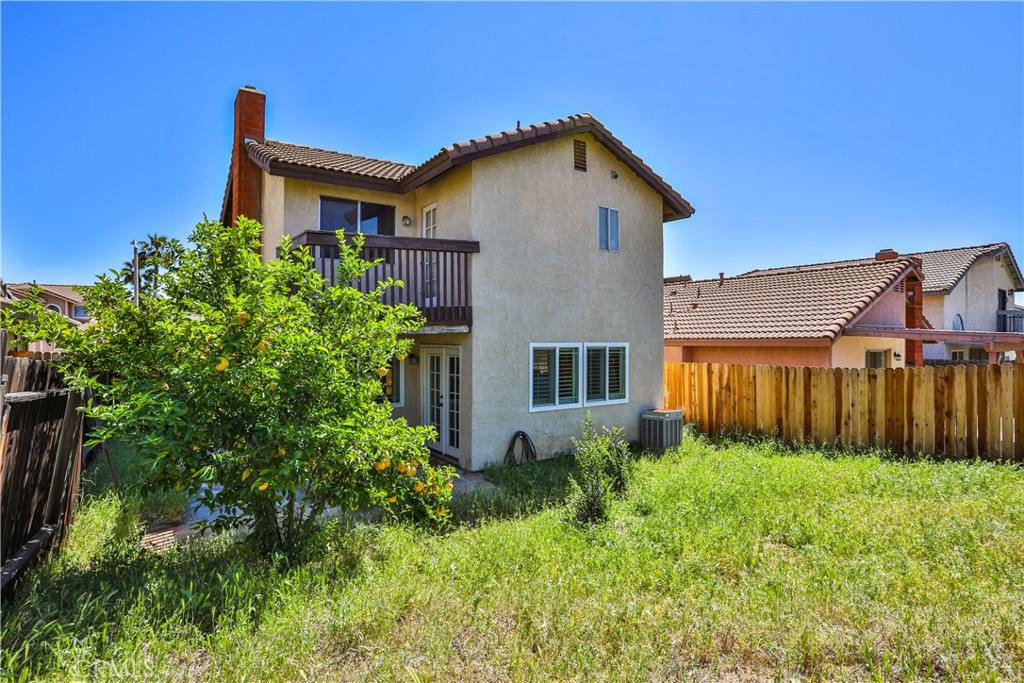 11369 Red Hill Road Moreno Valley, CA 92557 - Photo 34 of 41 a front view of a house with garden