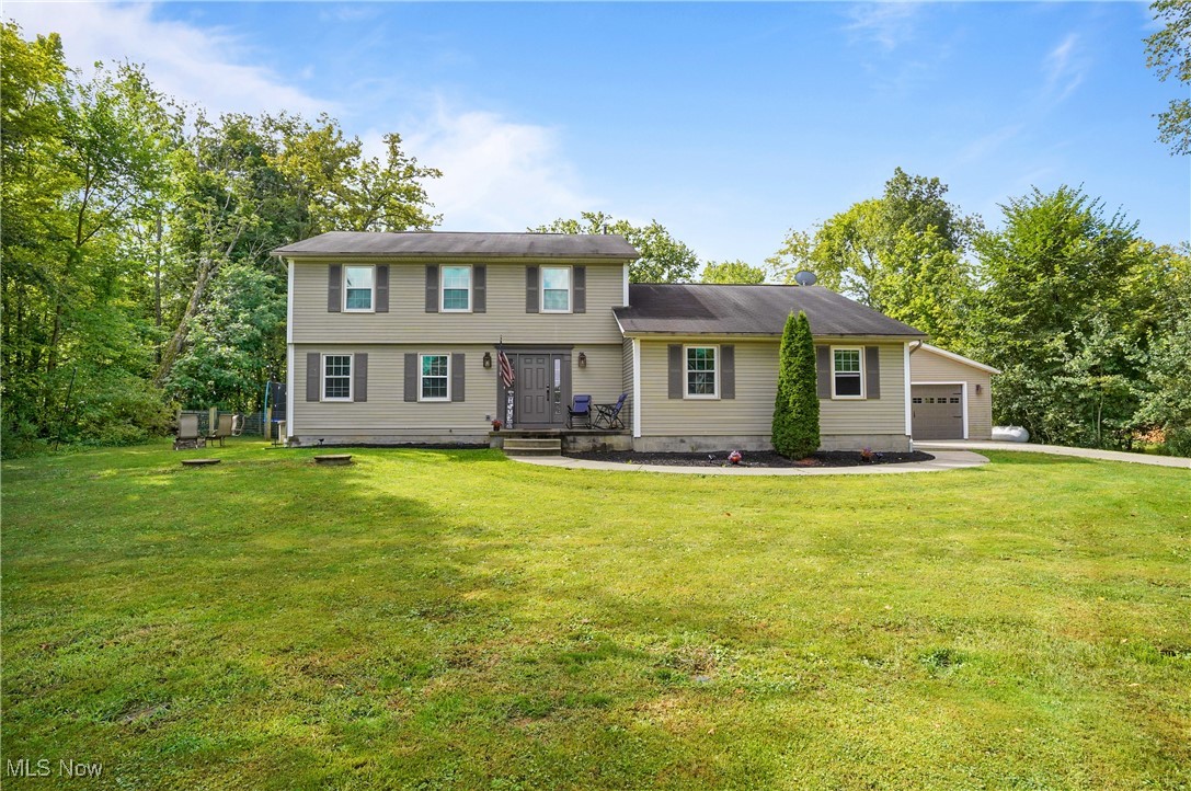 15575 Stillwell Road Huntsburg, OH 44046 - Photo 1 of 48 Colonial home with a front yard and driveway