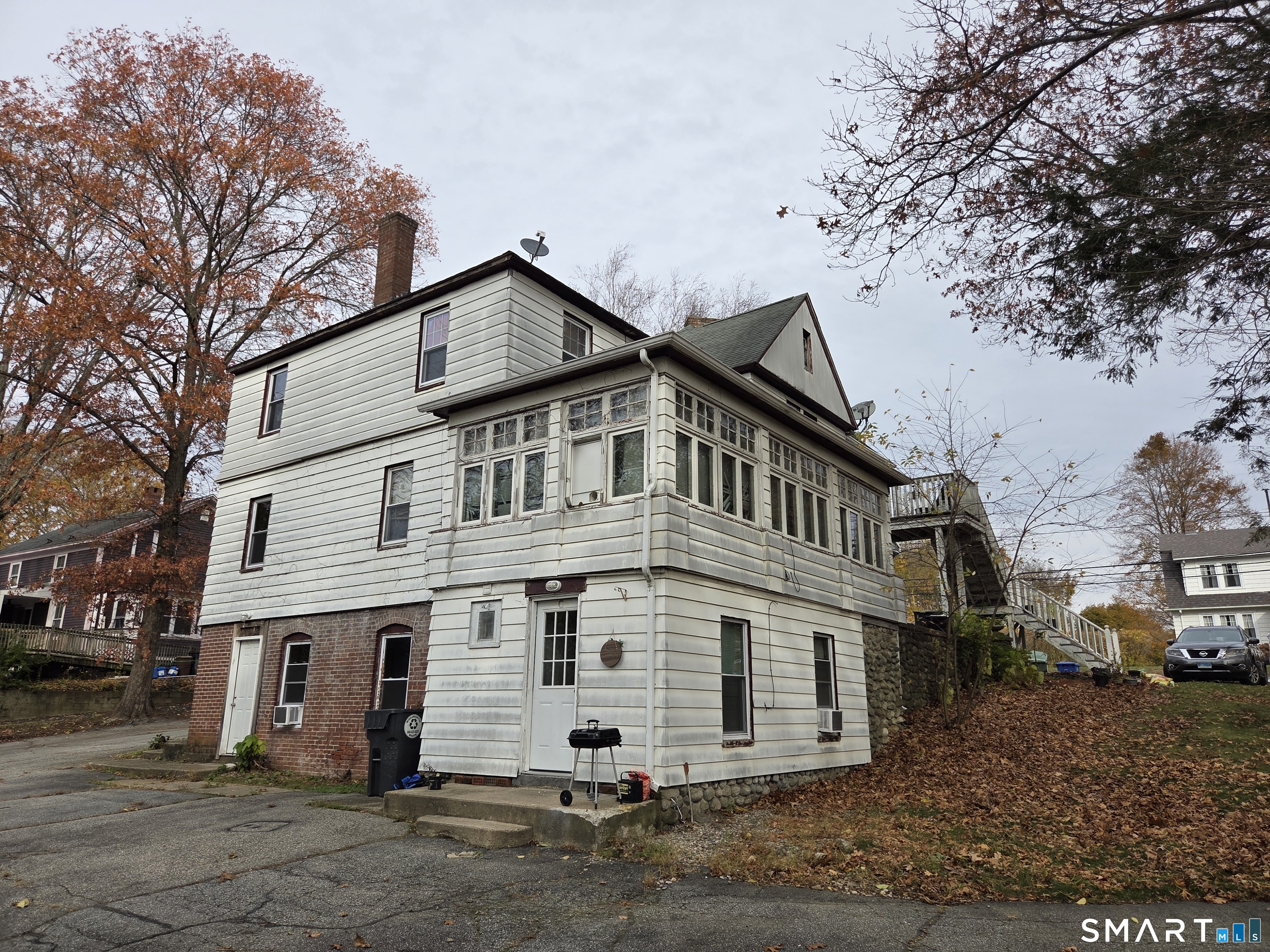 133 Maple Street Killingly, CT 06239 - Photo 5 of 12 a view of a white house with a yard
