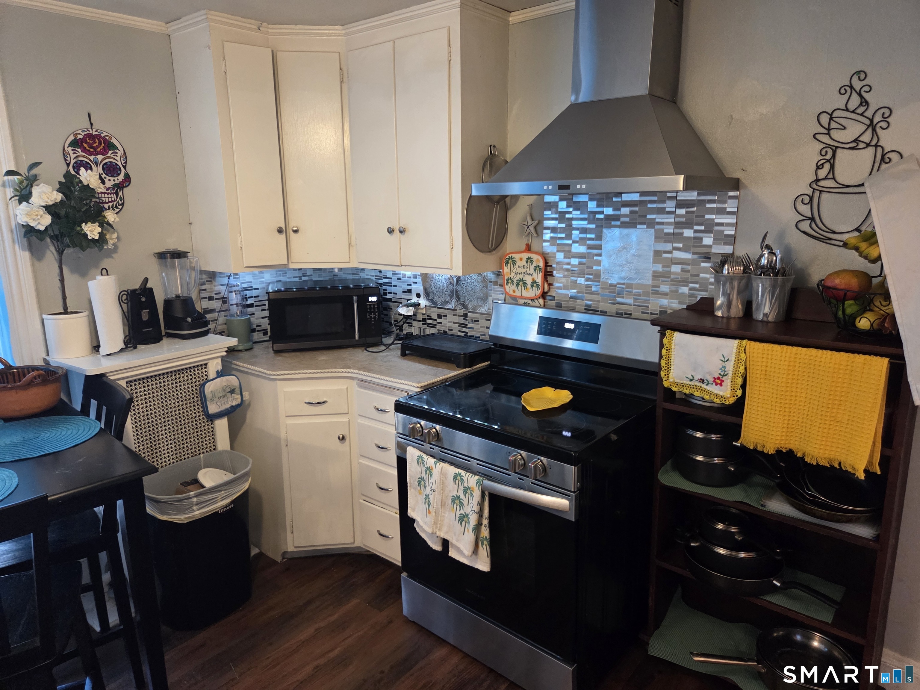 133 Maple Street Killingly, CT 06239 - Photo 9 of 12 a kitchen with a stove a counter space and a sink