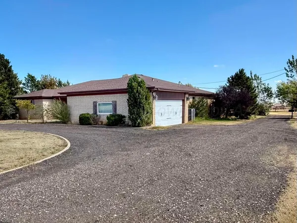 a view of a yard with an outdoor seating