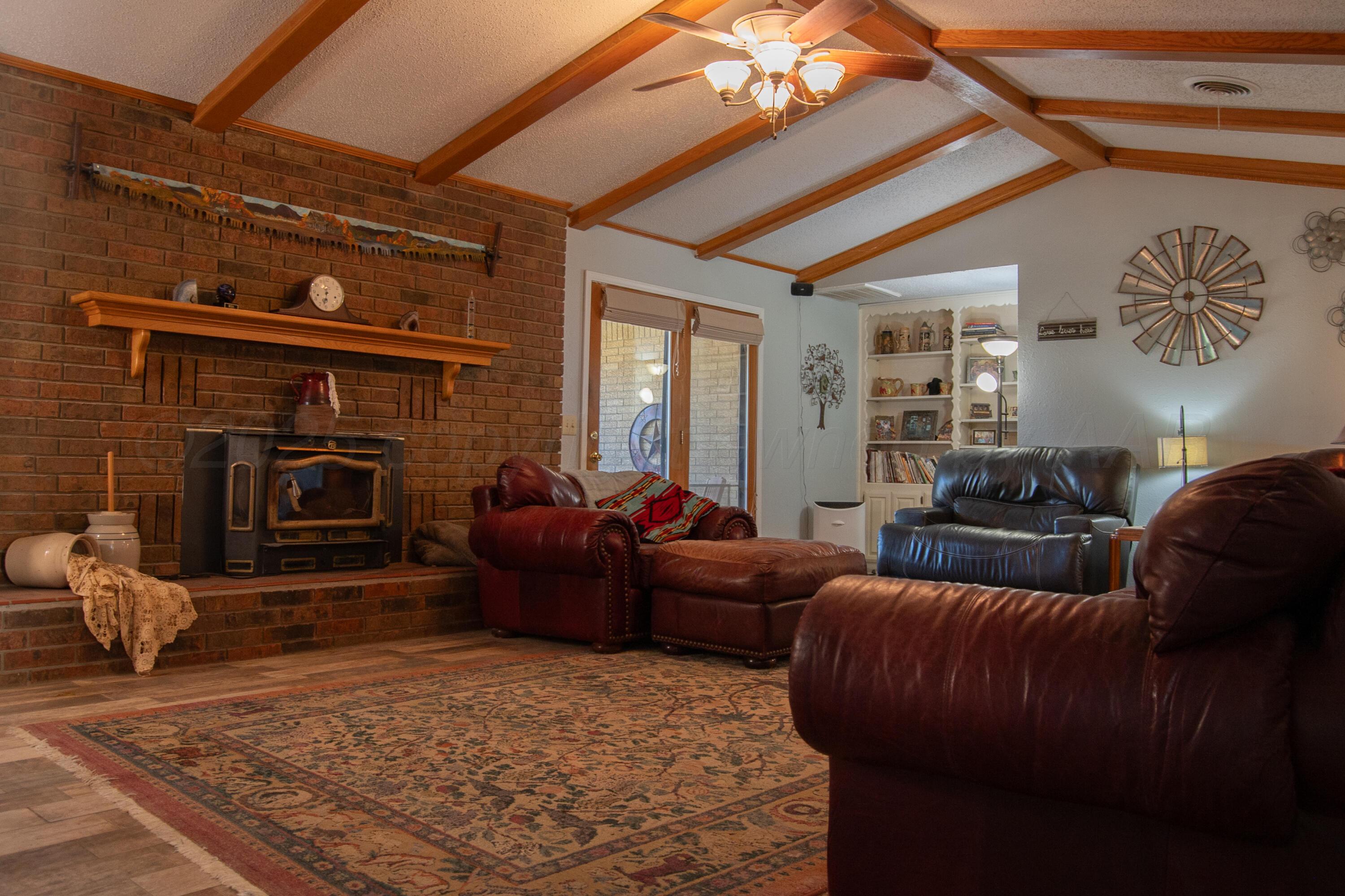 14653 Halsey Trail Amarillo, TX 79118 - Photo 33 of 66 a living room with furniture and a fireplace