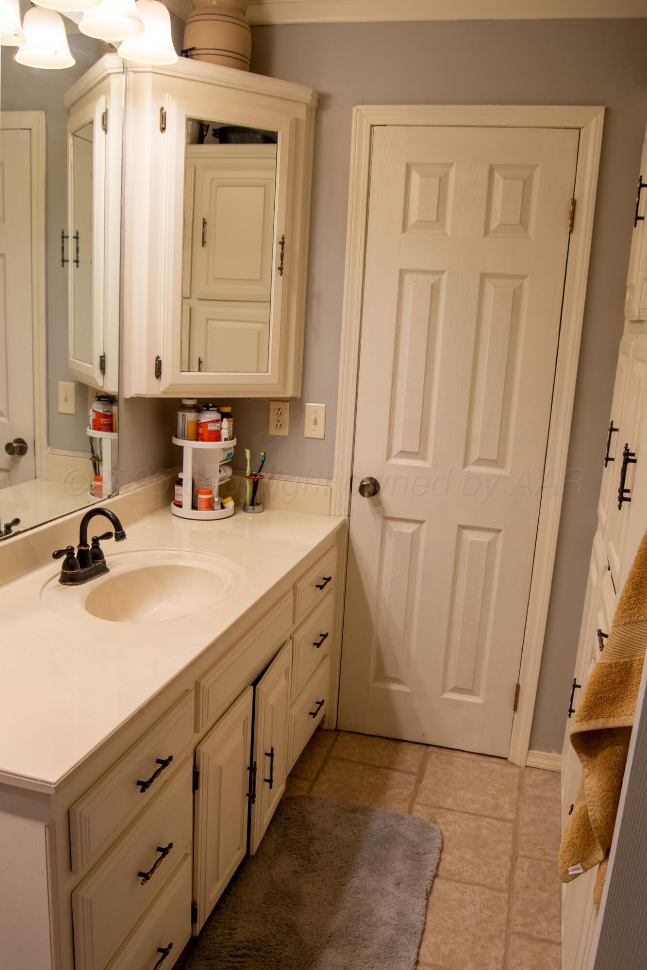 14653 Halsey Trail Amarillo, TX 79118 - Photo 39 of 66 a bathroom with a double vanity sink and a mirror
