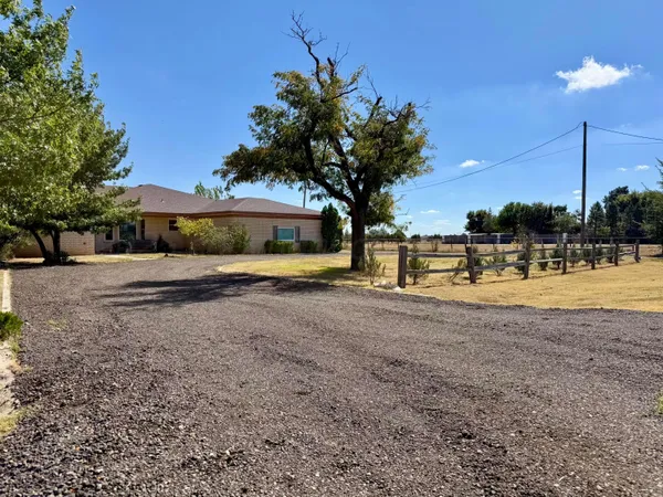 an aerial view of a house with outdoor space