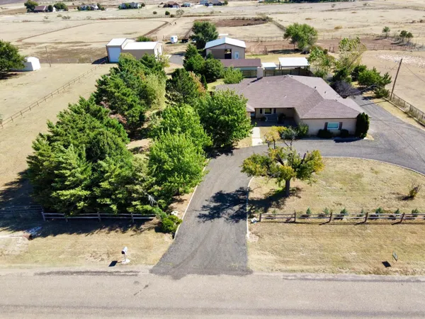 an outdoor space with furniture and city view