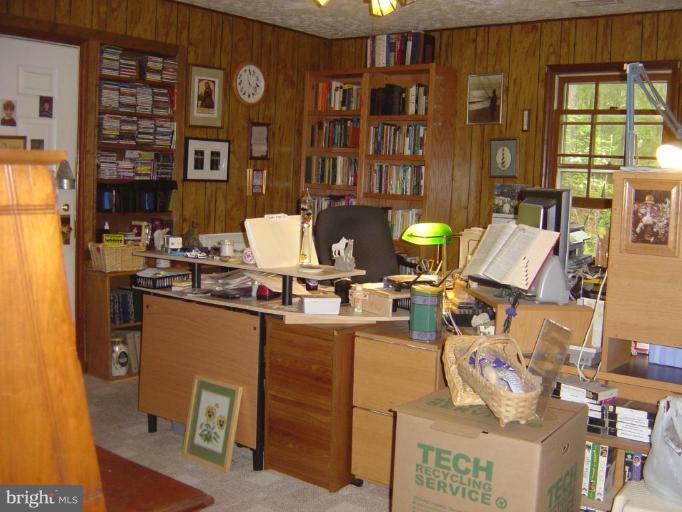 138 Windy Pines Road Front Royal, VA 22630 - Photo 12 of 17 a living room with fireplace furniture and a window
