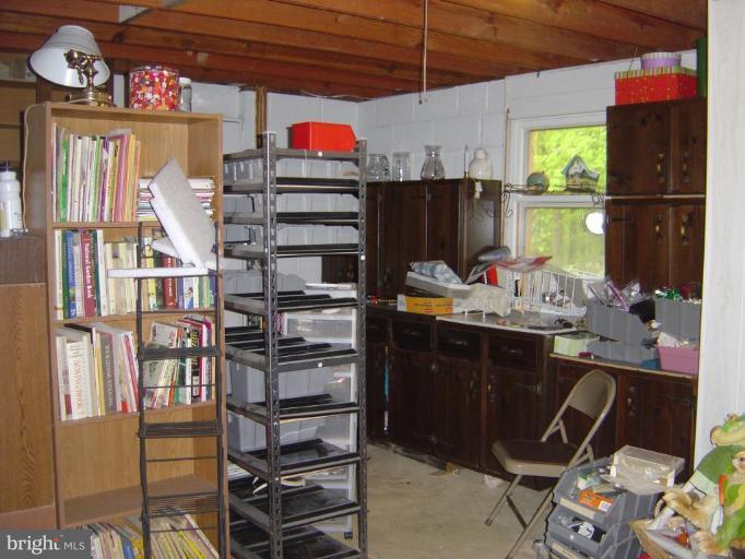 138 Windy Pines Road Front Royal, VA 22630 - Photo 14 of 17 a kitchen with stainless steel appliances kitchen island granite countertop a refrigerator and a stove top oven