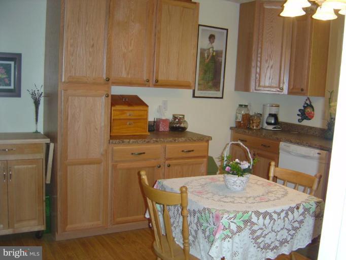 138 Windy Pines Road Front Royal, VA 22630 - Photo 10 of 17 a dining room with furniture and wooden floor