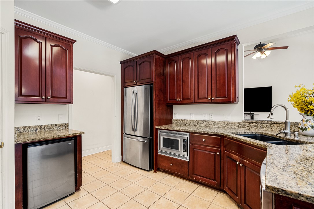 135 Sunset Bay Boulevard Seneca, SC 29672 - Photo 17 of 50 Granite counters and rich wood cabinetry create a well-appointed culinary space.