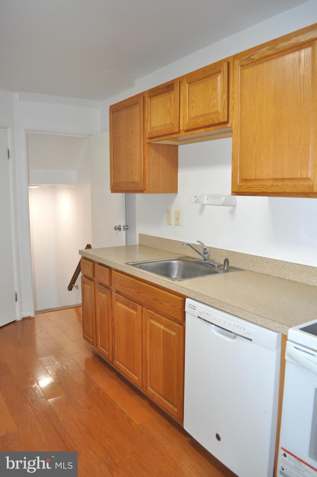 9110 Tumbleweed Run, Unit E Laurel, MD 20723 - Photo 12 of 39 Kitchen with gleaming hardwood floors