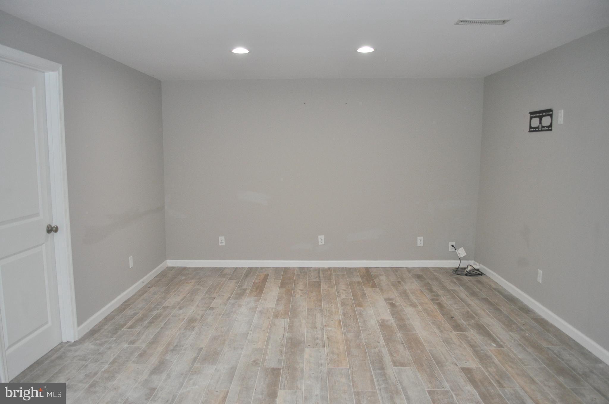 9110 Tumbleweed Run, Unit E Laurel, MD 20723 - Photo 20 of 39 Lower Level Family Room with recessed lighting