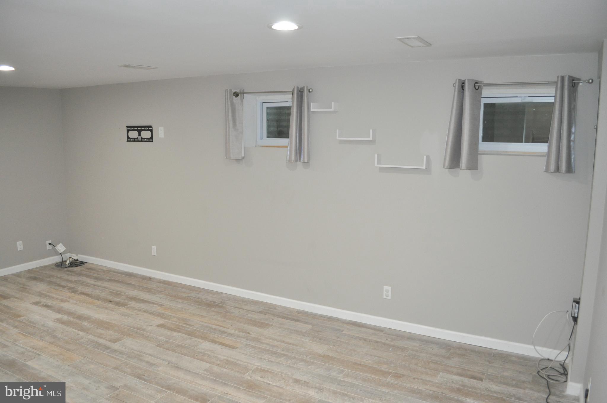 9110 Tumbleweed Run, Unit E Laurel, MD 20723 - Photo 21 of 39 Lower Level Family Room with windows