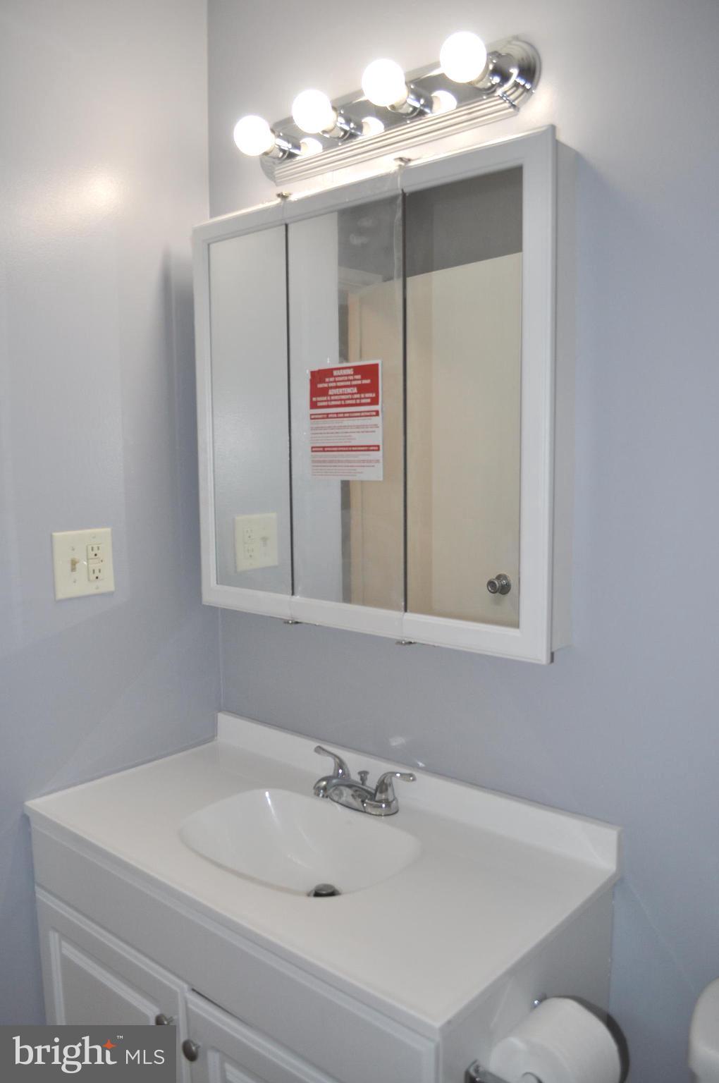 9110 Tumbleweed Run, Unit E Laurel, MD 20723 - Photo 29 of 39 Upper Level Bathroom with updated vanity