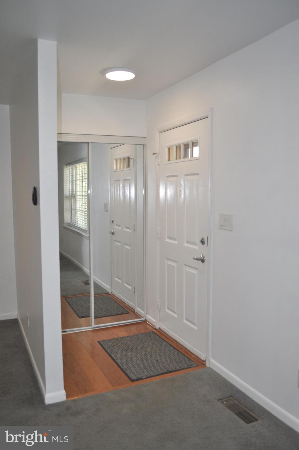 9110 Tumbleweed Run, Unit E Laurel, MD 20723 - Photo 4 of 39 Front Foyer with Mirrored Coat Closet