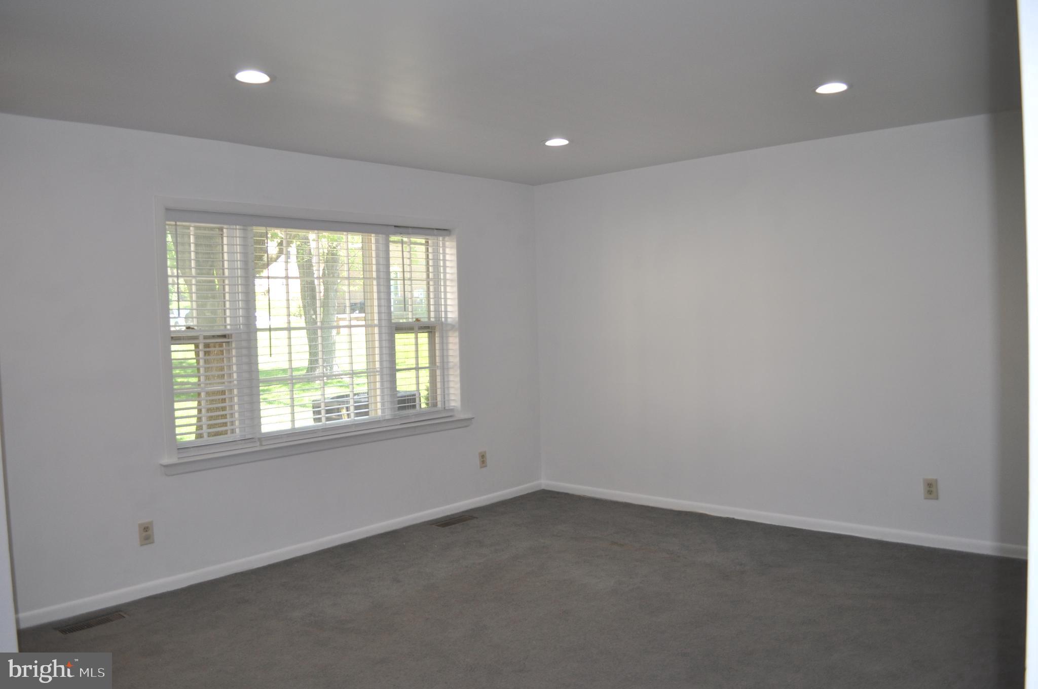 9110 Tumbleweed Run, Unit E Laurel, MD 20723 - Photo 6 of 39 Large Living Room with recessed lighting