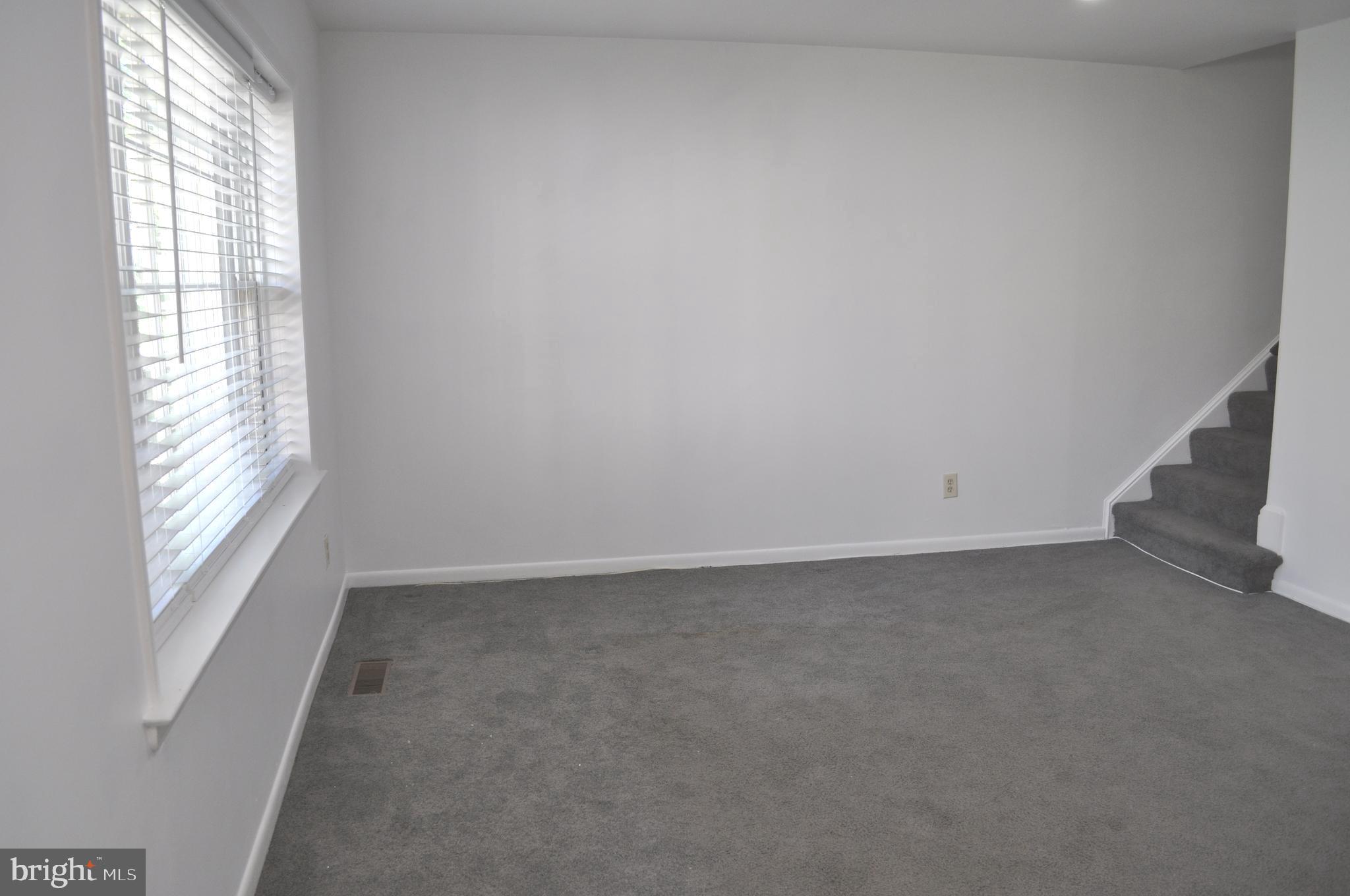 9110 Tumbleweed Run, Unit E Laurel, MD 20723 - Photo 7 of 39 Living Room with stairs to Upper Level