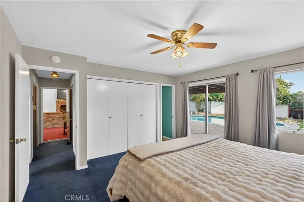 a view of room with window and dresser