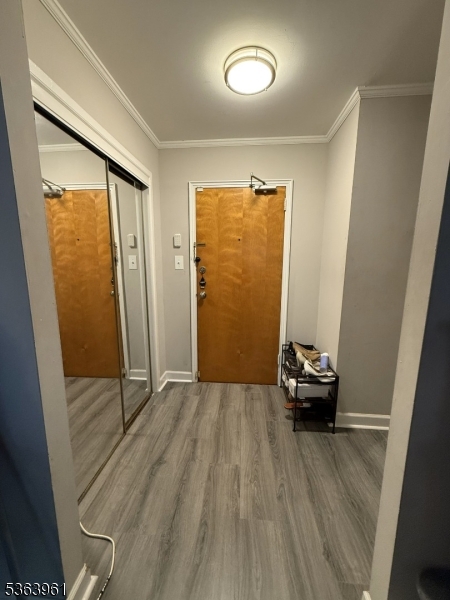 935 East Front Street Plainfield, NJ 07062 - Photo 2 of 25 an empty room with wooden floor and glass door